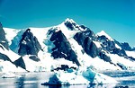 Free Stock Photo: Snow covered mountains by a lake