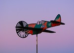 Free Stock Photo: An airplane weather vane with a sunset background