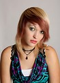 Free Stock Photo: A beautiful young woman posing before a grey background
