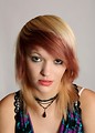 Free Stock Photo: A beautiful young woman posing before a grey background