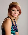 Free Stock Photo: A beautiful young woman posing before a gray background