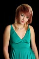 Free Stock Photo: A beautiful young woman in a dress isolated on a black background