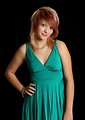 Free Stock Photo: A beautiful young woman in a dress isolated on a black background