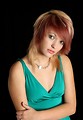 Free Stock Photo: A beautiful young woman in a dress isolated on a black background