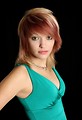 Free Stock Photo: A beautiful young woman in a dress isolated on a black background