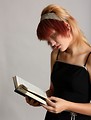 Free Stock Photo: A beautiful young girl reading a book