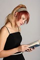 Free Stock Photo: A beautiful young girl reading a book