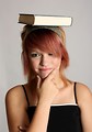 Free Stock Photo: A beautiful young girl balancing a book on her head