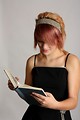 Free Stock Photo: A beautiful young girl reading a book