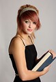 Free Stock Photo: A beautiful young girl holding a book