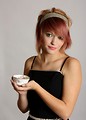 Free Stock Photo: A beautiful young woman holding a tea cup