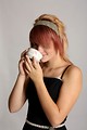 Free Stock Photo: A beautiful young woman holding a tea cup