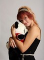 Free Stock Photo: A beautiful young girl holding a stuffed panda bear
