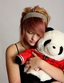 Free Stock Photo: A beautiful young girl holding a stuffed panda bear
