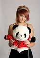 Free Stock Photo: A beautiful young girl holding a stuffed panda bear