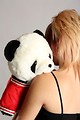 Free Stock Photo: A beautiful young girl holding a stuffed panda bear