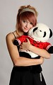 Free Stock Photo: A beautiful young girl holding a stuffed panda bear
