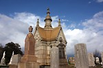 Free Stock Photo: A small mausoleum and tombstones at historic Oakland Cemetery in Atlanta, Georgia