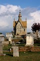Free Stock Photo: A small mausoleum and tombstones at historic Oakland Cemetery in Atlanta, Georgia