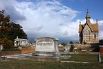 Free Stock Photo: A small mausoleum and tombstones at historic Oakland Cemetery in Atlanta, Georgia