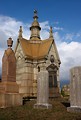 Free Stock Photo: A small mausoleum and tombstones at historic Oakland Cemetery in Atlanta, Georgia