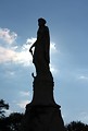 Free Stock Photo: Silhouette of a large statued tombstone at historic Oakland Cemetery in Atlanta, Georgia.