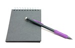 Free Stock Photo: A pad of paper and a pencil isolated on a white background