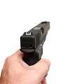 Free Stock Photo: A hand holding and aiming a pistol
