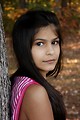 Free Stock Photo: A beautiful young girl posing outdoors by a tree