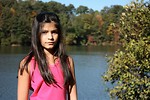 Free Stock Photo: A beautiful young girl posing outdoors by a lake