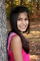 Free Stock Photo: A beautiful young girl posing outdoors by a tree