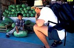 Free Stock Photo: Man and boy by stack of watermelons