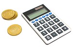 Free Stock Photo: A calculator and a stack of gold coins