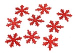 Free Stock Photo: Red snowflake shaped Christmas ornaments isolated on a white background