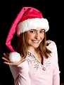 Free Stock Photo: A beautiful young girl posing in a pink santa hat