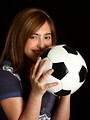 Free Stock Photo: A cute young girl posing with a soccer ball