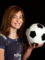 Free Stock Photo: A cute young girl posing with a soccer ball