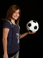 Free Stock Photo: A cute young girl posing with a soccer ball