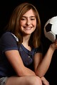 Free Stock Photo: A cute young girl posing with a soccer ball