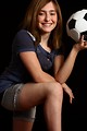 Free Stock Photo: A cute young girl posing with a soccer ball
