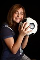 Free Stock Photo: A cute young girl posing with a soccer ball