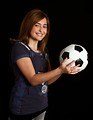 Free Stock Photo: A cute young girl posing with a soccer ball