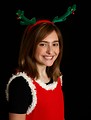Free Stock Photo: A cute young girl posing in a Christmas outfit