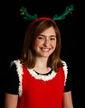 Free Stock Photo: A cute young girl posing in a Christmas outfit