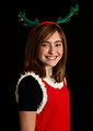 Free Stock Photo: A cute young girl posing in a Christmas outfit