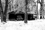 Free Stock Photo: Antique cars stored in a garage surrounded by snow