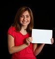 Free Stock Photo: A cute young girl holding a blank sign
