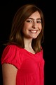 Free Stock Photo: A cute young girl posing in a pink shirt on a black background
