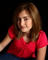 Free Stock Photo: A cute young girl posing on a black background