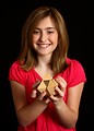 Free Stock Photo: A cute young girl holding a wooden puzzle